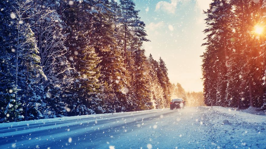 Car on snowy country road