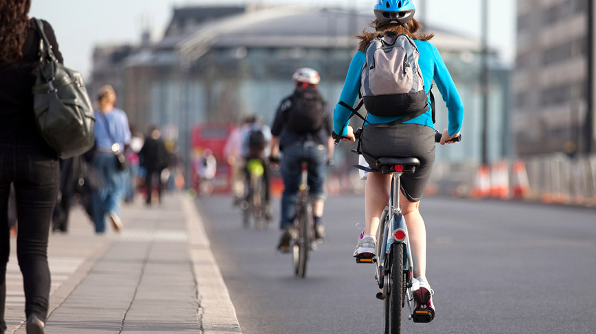 Cyclists in city traffic 3
